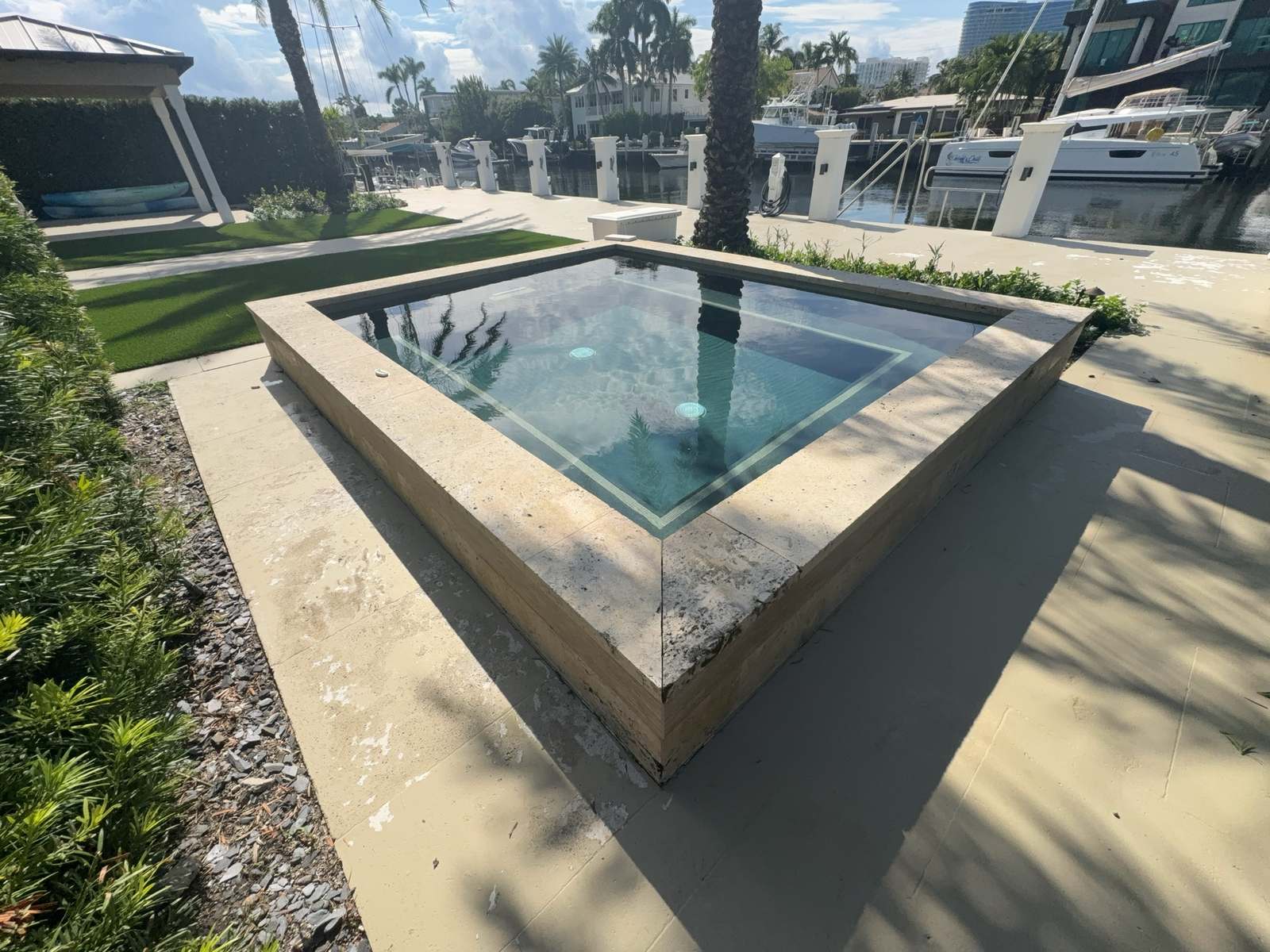 Raised spa on a Fort Lauderdale canal, serviced by Downtown Pools