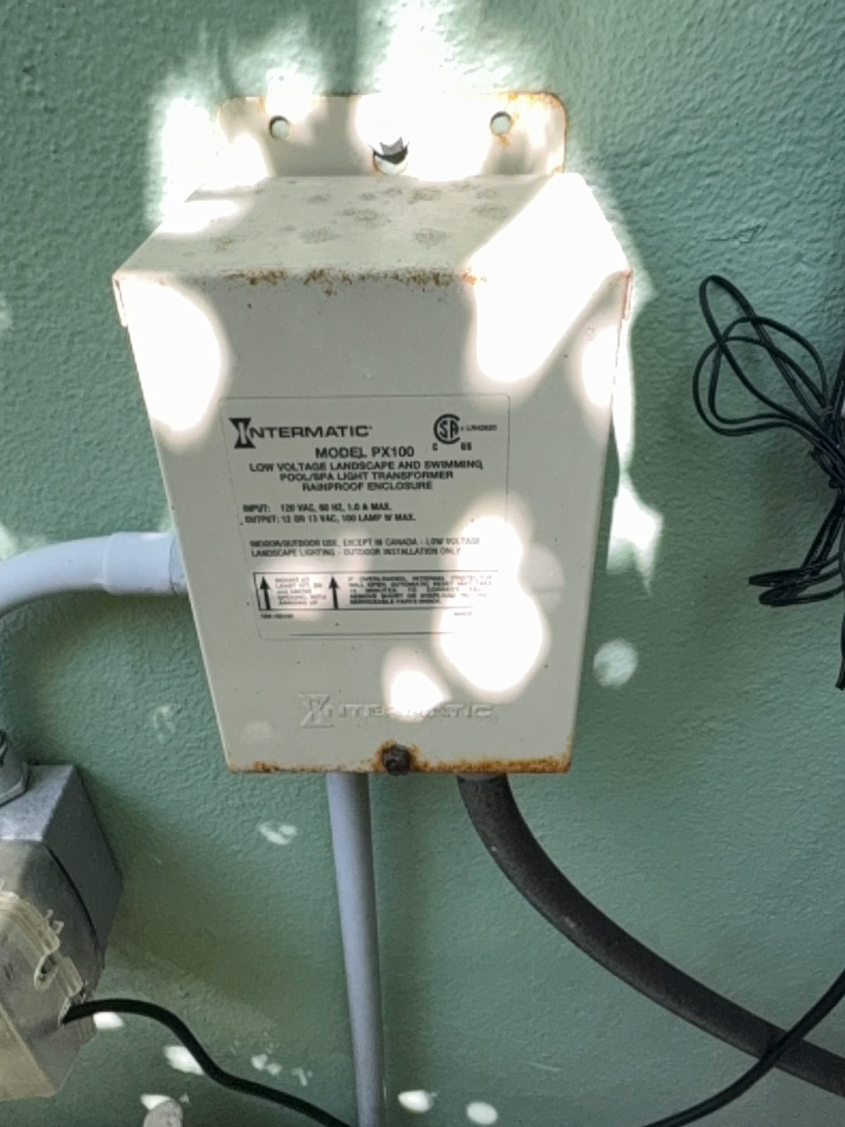 light-transformer - Downtown Pools Low-voltage pool light transformer mounted beside an equipment pad