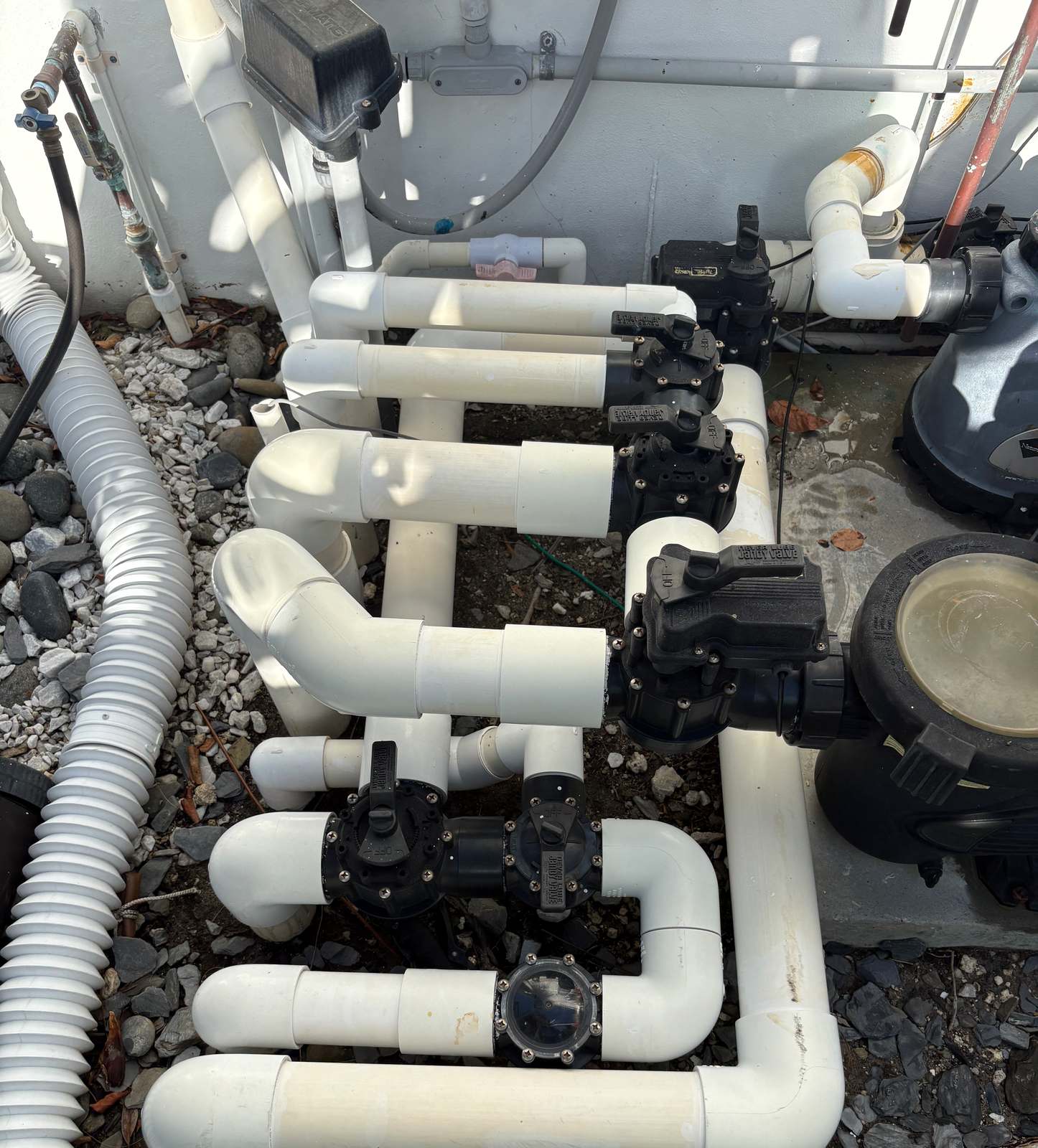 Jandy valve manifold on a Broward County equipment pad